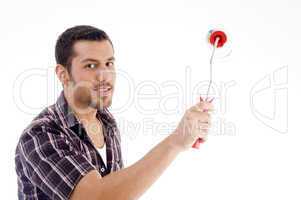 male holding roller brush