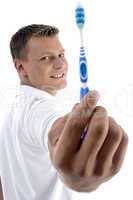 health care man showing his toothbrush