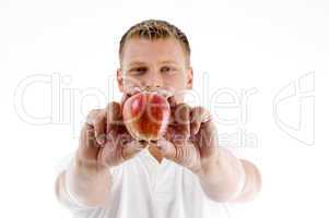 male holding apple with both hands