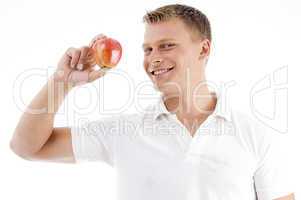 smiling man holding apple