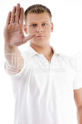 handsome male in stopping gesture