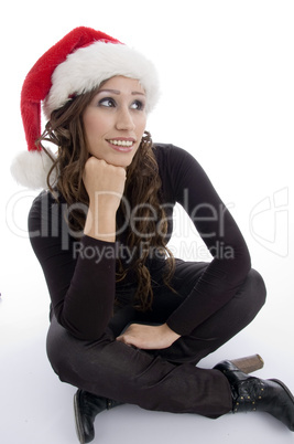 sitting woman wearing christmas hat