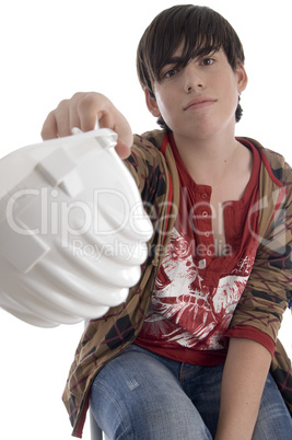 smiling young architect showing his helmet