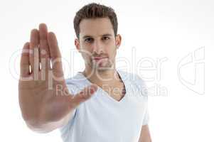 young man showing stop gesture