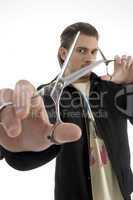 hair stylist holding a pair of scissors