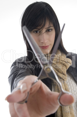 female barber holding scissors