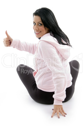 back pose of female with thumbs up on white background