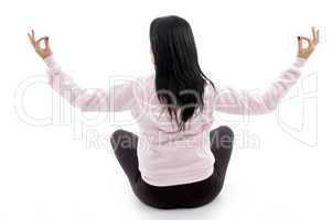 back pose of female in lotus pose on white background