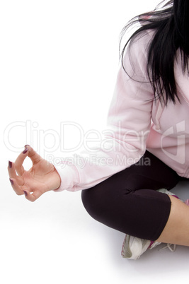 half length view of female in lotus pose on white background