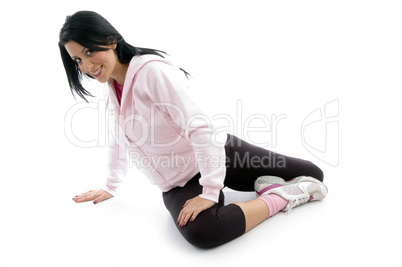 side view of female doing exercise on white background