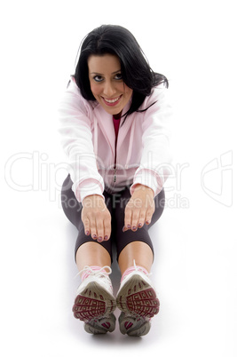 front view of smiling exercising female on white background