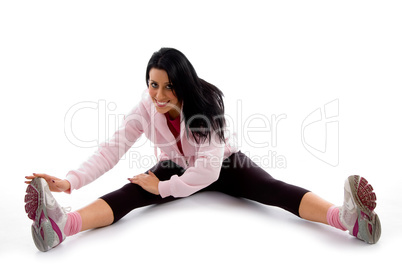 front view of smiling exercising woman on white background