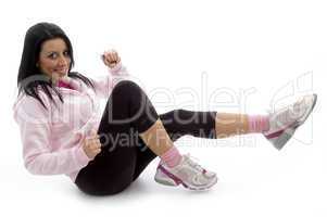 side view of exercising woman on white background