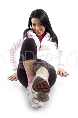 front view of smiling exercising female on white background