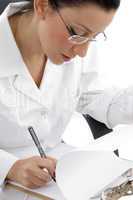 side view of writing female doctor on white background