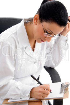 side view of female doctor doing work on white background