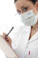 female doctor with mask and writing prescription on white background