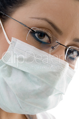 female doctor with mask on white background