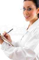 side pose of doctor with writing pad and pen on white background