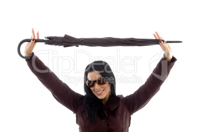 portrait of female carrying umbrella on white background