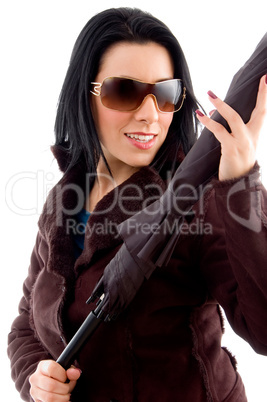 side pose of woman holding umbrella on white background