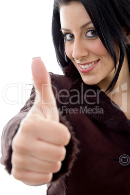 half length view of female with thumbs up on white background
