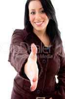 front view of smiling model offering handshake on white background