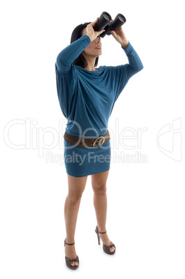 side view of woman looking through binocular on white background