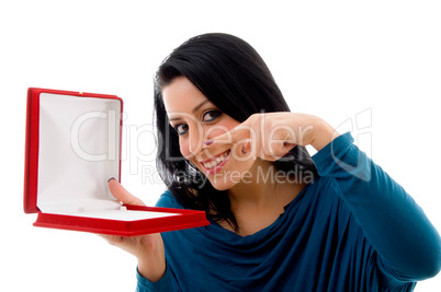 portrait of smiling pointing female on white background