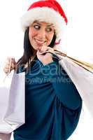 side pose of christmas woman holding bags on white background