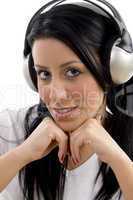 portrait of  smiling woman listening music