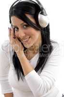 front view of cheerful woman listening music