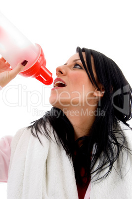portrait of woman taking refreshment on white background