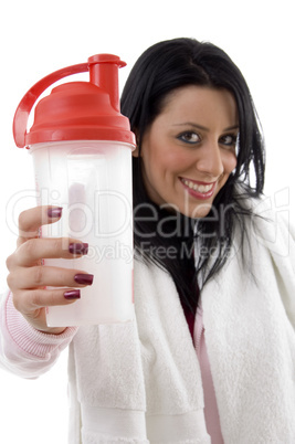 portrait of smiling woman posing with water bottle