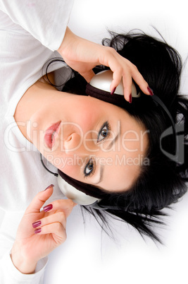 top view of female listening music on white background