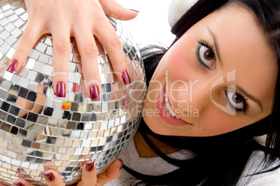 top view of woman holding disco mirror ball with white background