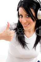 front view of woman showing thumb up on white background