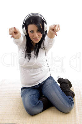 top view of pointing woman wearing headphone