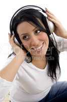 top view of smiling woman posing with headphone