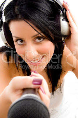 top view of female with headphone and microphone with white background