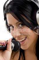 close up of smiling female with headphone and microphone
