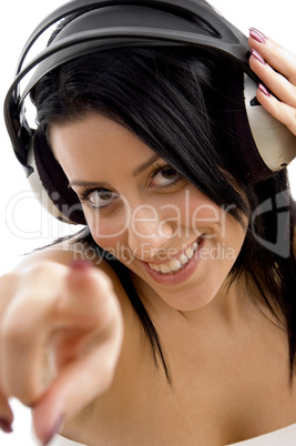 close up of smiling female holding headphone