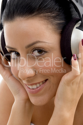 close up of smiling female wearing headphone