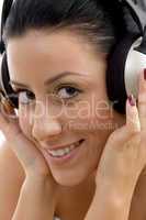 close up of smiling female wearing headphone