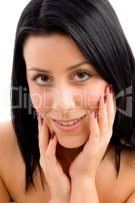 close up of smiling young female against white background