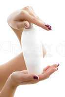 portrait of hands with lotion bottle