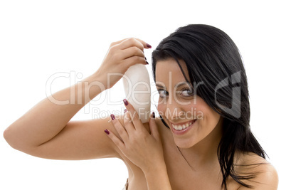 portrait of female with lotion bottle