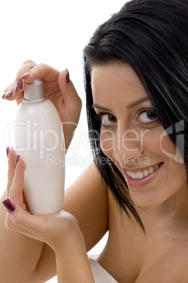 portrait of woman with lotion bottle