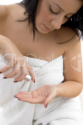 front view of woman taking lotion