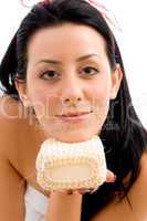 front view of woman with scrubber on white background